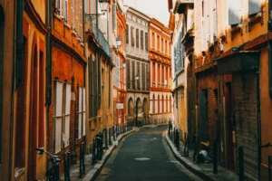 people walking on street between buildings during daytime