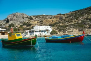 A group of boats floating on top of a body of water