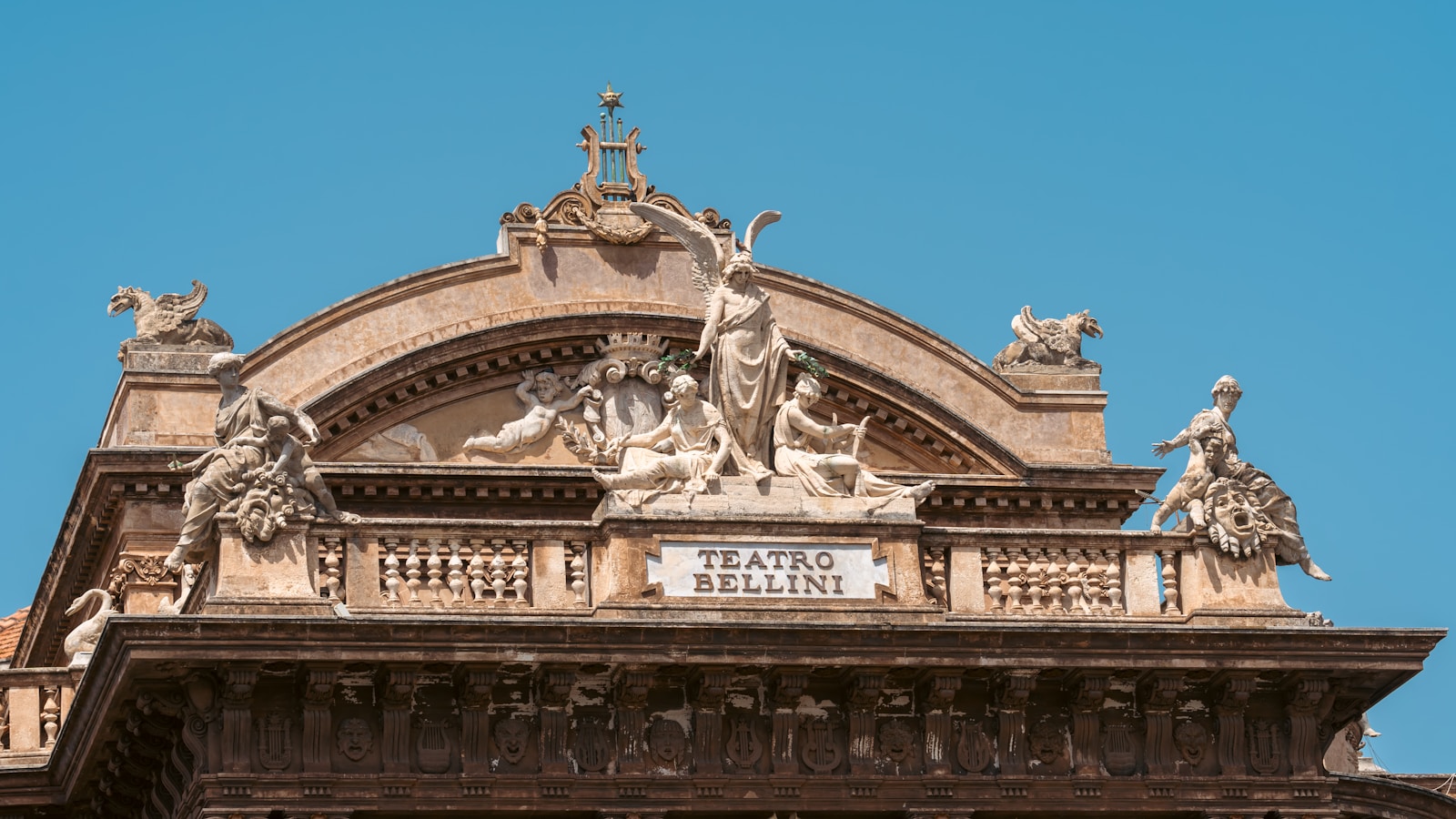 A large building with statues on top of it